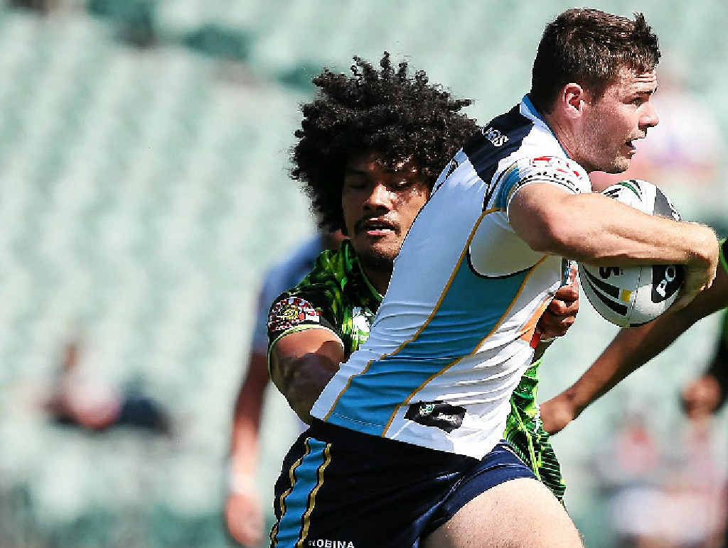 ON THE FLY: Titans fullback Anthony Don skips through the Warriors defence during yesterday’s trial match in Auckland. ON THE FLY: Titans fullback Anthony Don skips through the Warriors defence during yesterday’s trial match in Auckland.